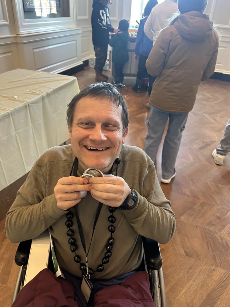 Noah holding his button